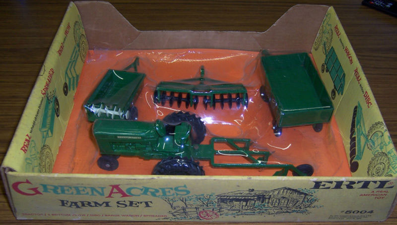 Ertl produced these fine die cast metal toys of Green Acres' farm equipment (Front of Box)