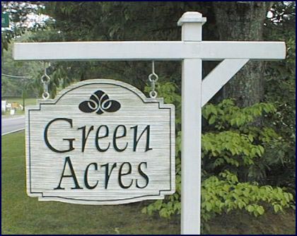 A Green Acres Yard Sign