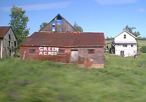 A farmhouse spotted by A. W. Smith while on a train ride from NYC to Montreal Canada.