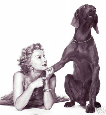 Eva Gabor posing with dog